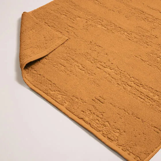 Duurzame honing Luna badmat van 67% gerecycled katoen en 33% polyester, 500 g/m², hoge kwaliteit, zacht, absorberend en sneldrogend.