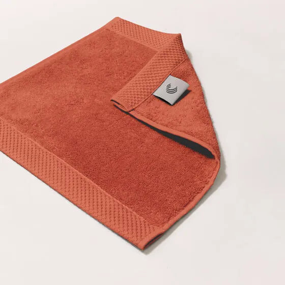 Luxe koraal Florence gezichtsdoeken (4 stuks) van 100% GOTS-katoen, 600 g/m², hoge kwaliteit, zacht en absorberend.