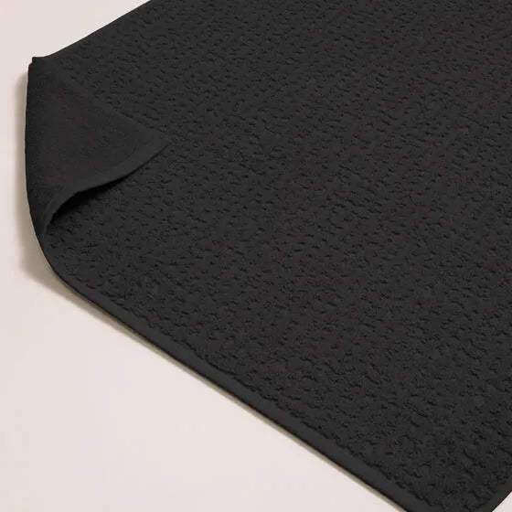 Luxe antraciet Florence badmat van 100% GOTS-katoen, 600 g/m², hoge kwaliteit, zacht en absorberend.