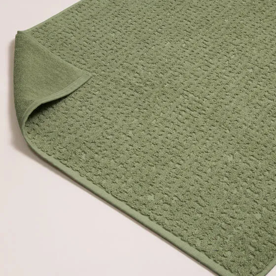 Luxe groen Florence badmat van 100% GOTS-katoen, 600 g/m², hoge kwaliteit, zacht en absorberend.