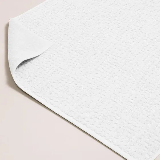 Luxe ivoor Florence badmat van 100% GOTS-katoen, 600 g/m², hoge kwaliteit, zacht en absorberend.
