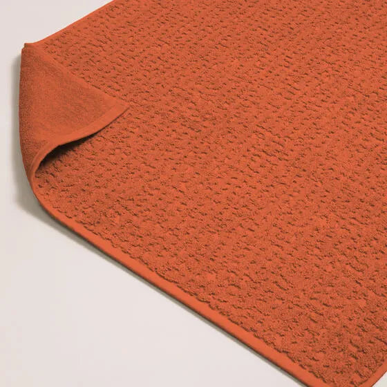 Luxe koraal Florence badmat van 100% GOTS-katoen, 600 g/m², hoge kwaliteit, zacht en absorberend.