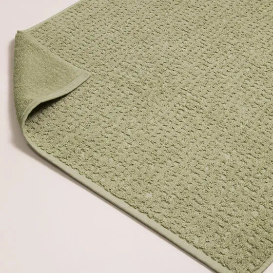 Luxe lichtgroen Florence badmat van 100% GOTS-katoen, 600 g/m², hoge kwaliteit, zacht en absorberend.
