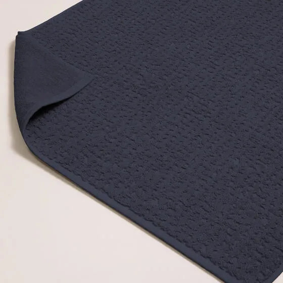Luxe marineblauw Florence badmat van 100% GOTS-katoen, 600 g/m², hoge kwaliteit, zacht en absorberend.