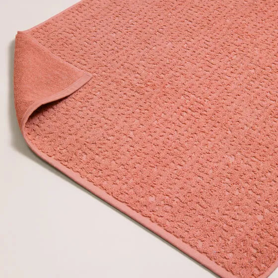 Luxe terra Florence badmat van 100% GOTS-katoen, 600 g/m², hoge kwaliteit, zacht en absorberend.