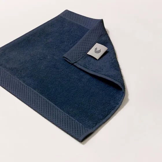 Luxe marineblauw Florence gezichtsdoeken (4 stuks) van 100% GOTS-katoen, 600 g/m², hoge kwaliteit, zacht en absorberend.